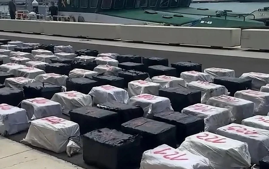 Police officers inspecting drug boat